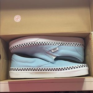 baby blue with checker boarder slip on vans